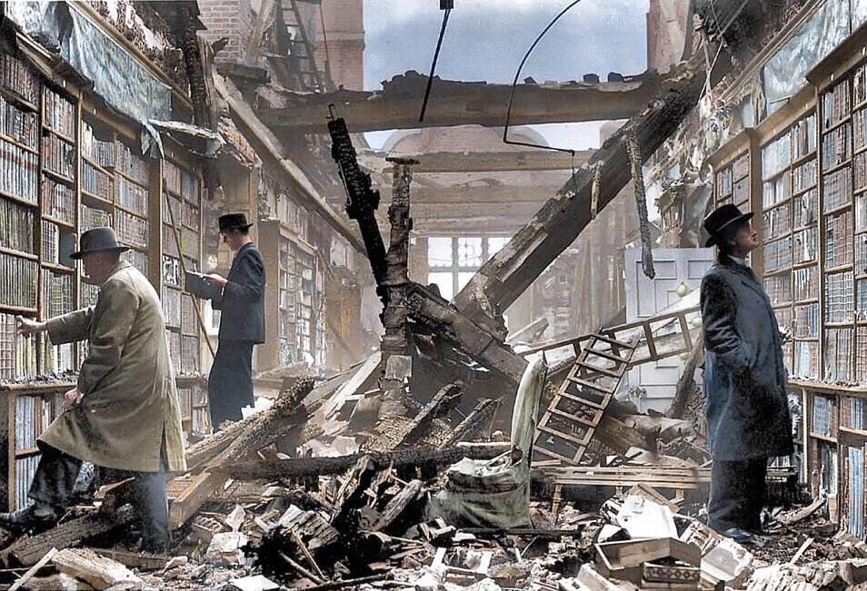 Locals browsing through the bombed ruins of the Great Library of Holland House in London, Sept 1940.jpg
