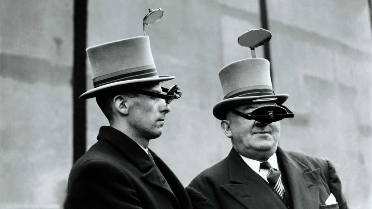 Two men wearing periscope top hats (1937).jpg