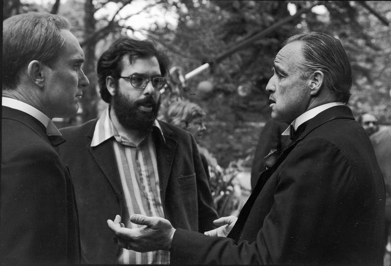 Director-Francis-Ford-Coppola-talks-with-actors-Robert-Duvall,-left,-and-Marlon-Brando-on-location-for-The-Godfather,-1971.jpg