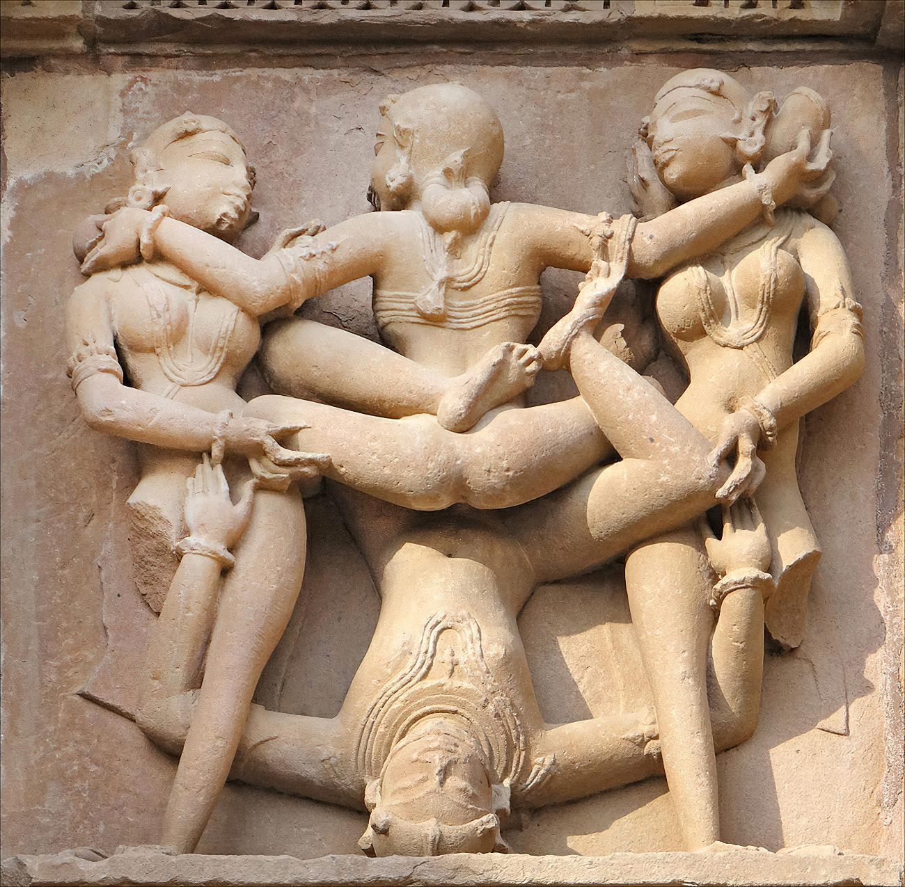 Four lovers (mithuna) engaging in tantric sex, depicted on a relief at Kandariya Mahadeva Temple. Khajuraho, India, Chandela dynasty, around 1030 AD.jpg