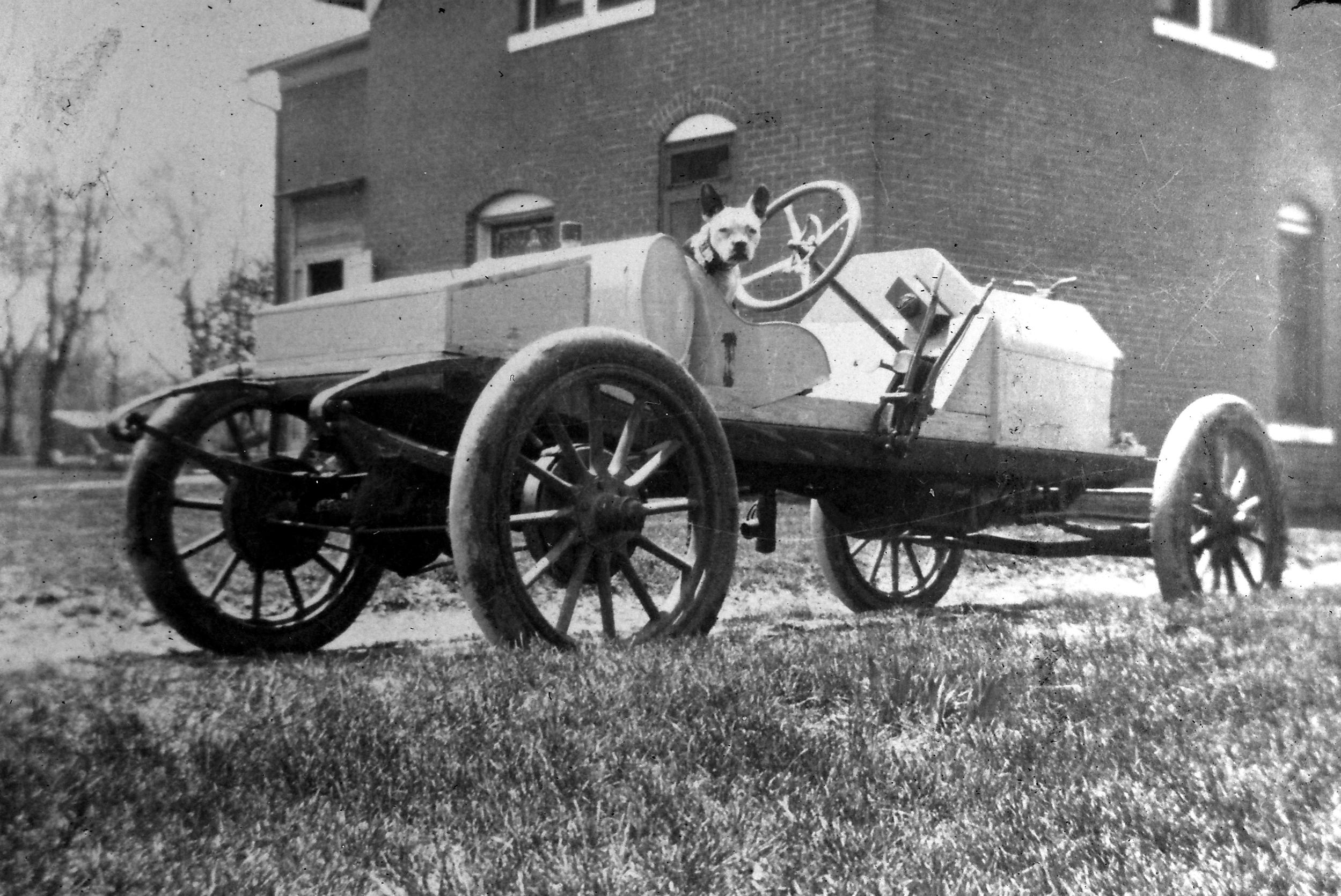 Grandpa's first car, a Stutz Bearcat and his dog Stub. Circa 1916.jpg