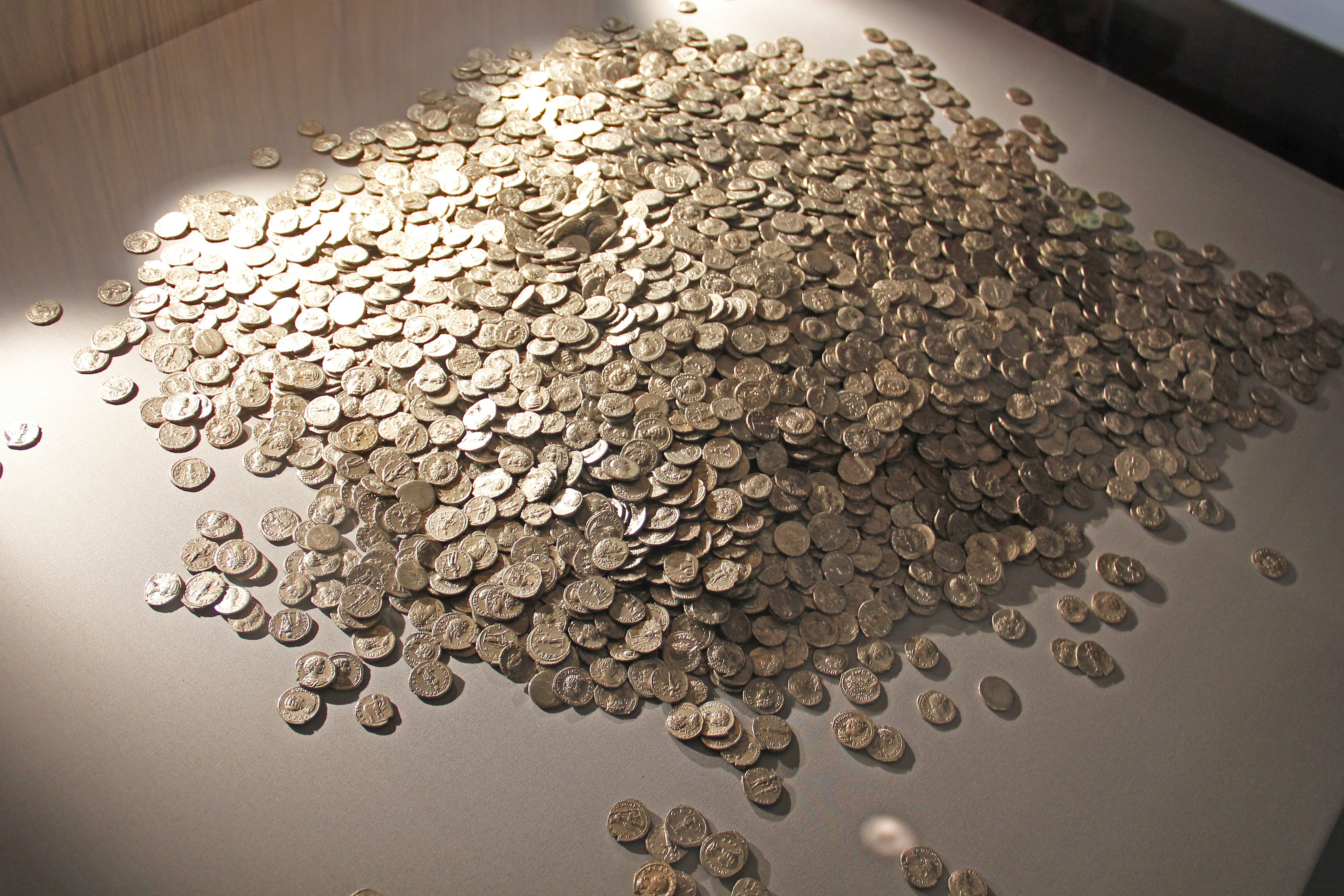 A small part of the Shapwick Hoard, the largest hoard of Roman silver denarii ever found in the UK. The 9,262 silver coins were found by a detectorist in 1998.jpg