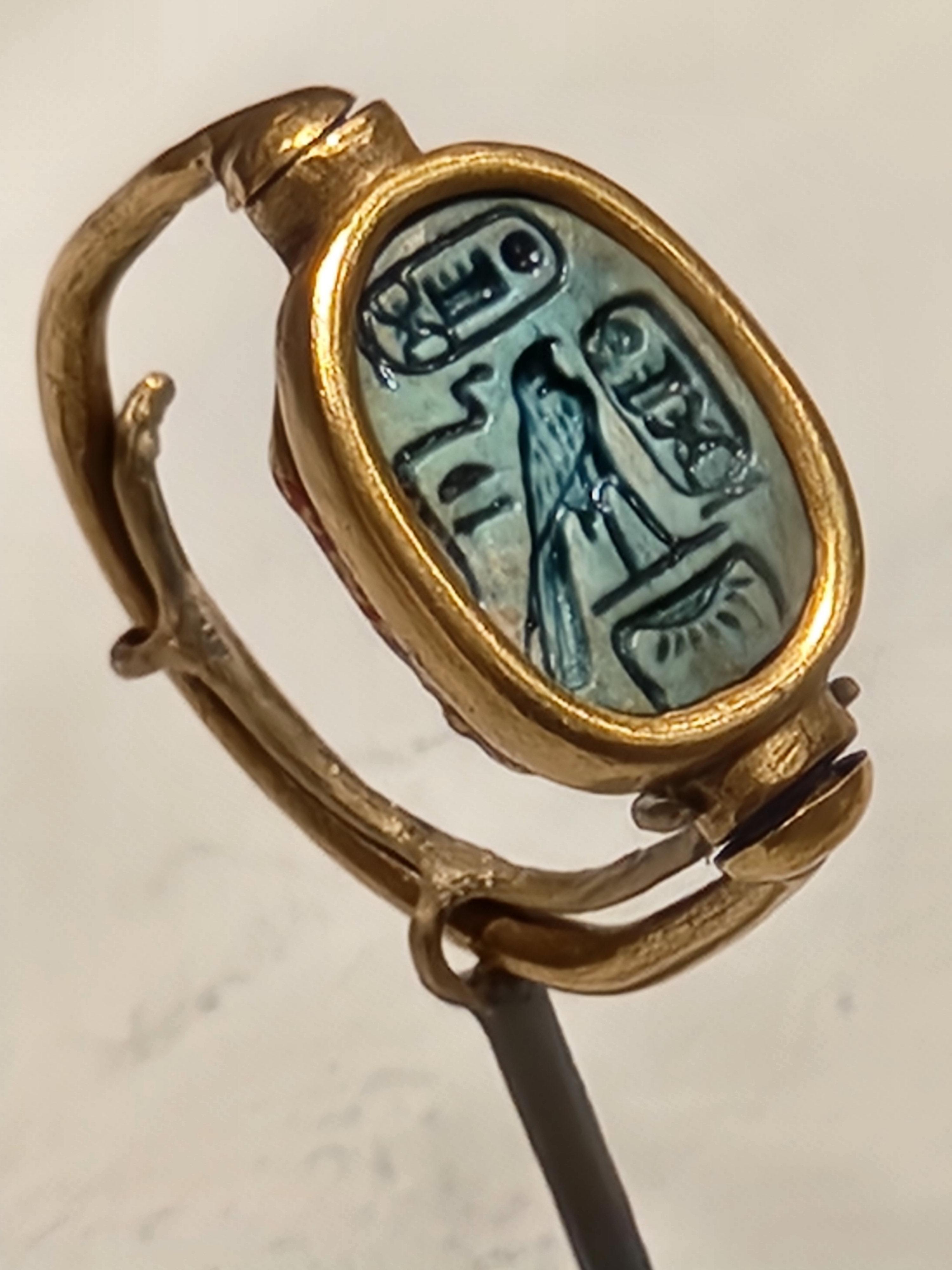 Gold ring with green glazed steatite scarab set in a gold swivel bezel. New Kingdom Egypt, ca. 1479-1425 BC.jpg