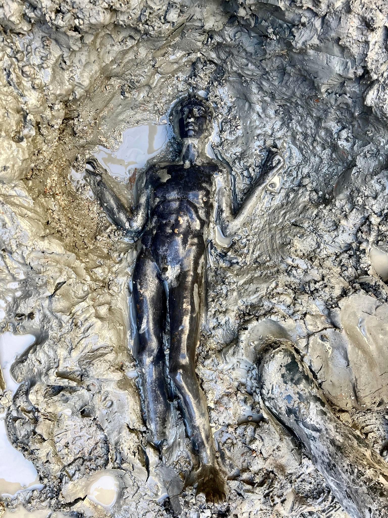 24 bronze statues just discovered in a network of baths built by the Etruscans in Tuscany, dating back 2300 years. They were preserved by mud and boiling water from the hot springs in the baths).jpg
