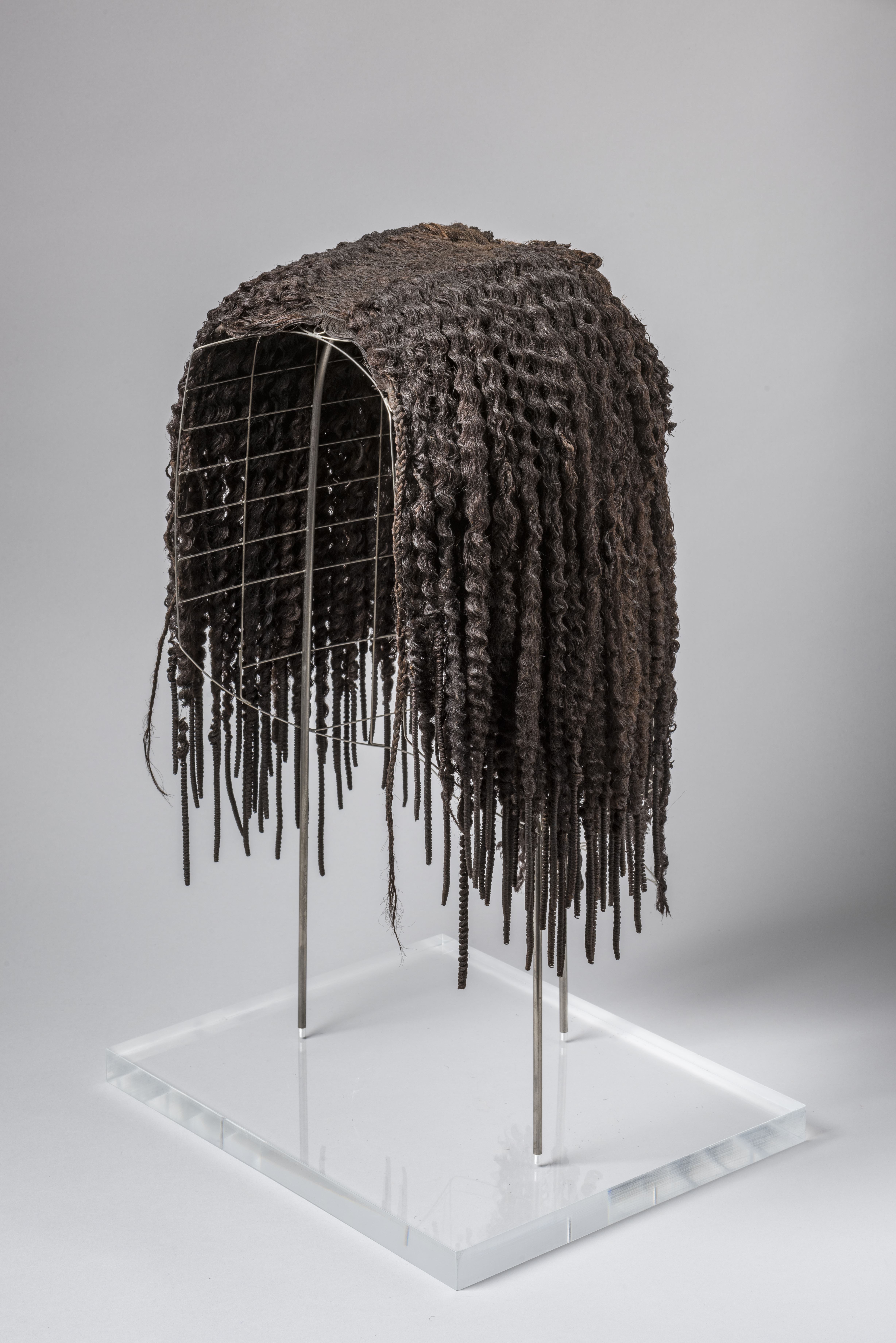 A human hair wig that belonged to Merit, the wife of the foreman Kha who oversaw works under the reigns of pharaohs Amenhotep II, Thutmose IV, and Amenhotep III.jpg