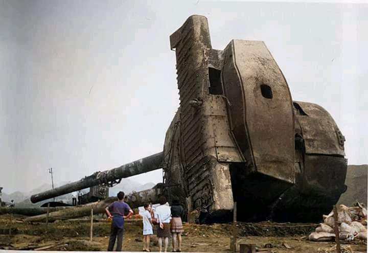 A photo from japan in 1975 with a massive recovered main battery on a WW2 battleship IJN Mutsu that mysteriously exploded its magazine while anchored in 1942.jpg