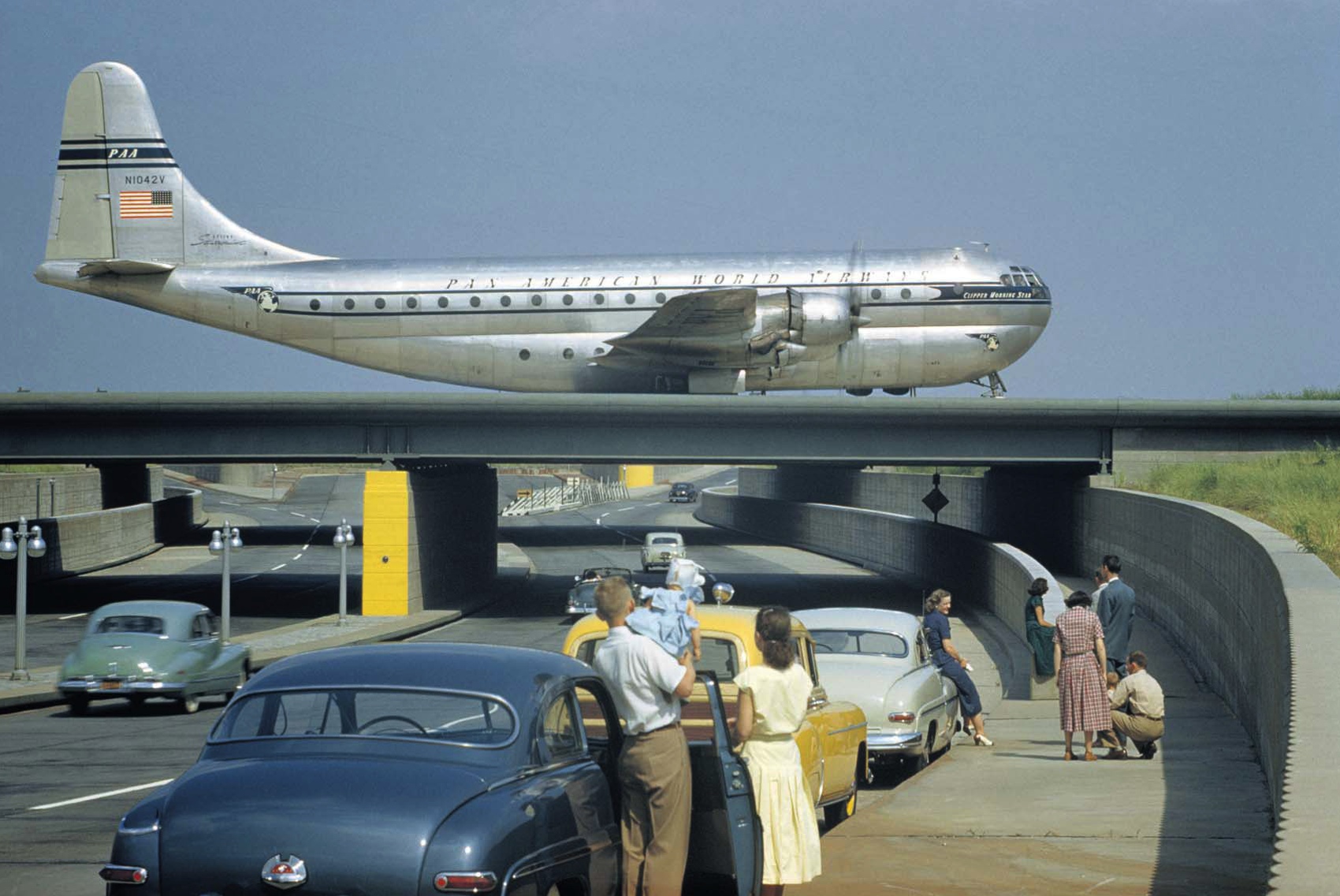 Watching a Pan Am Stratocruiser taxi across an underpass in Queens, New York, March 1951.jpg