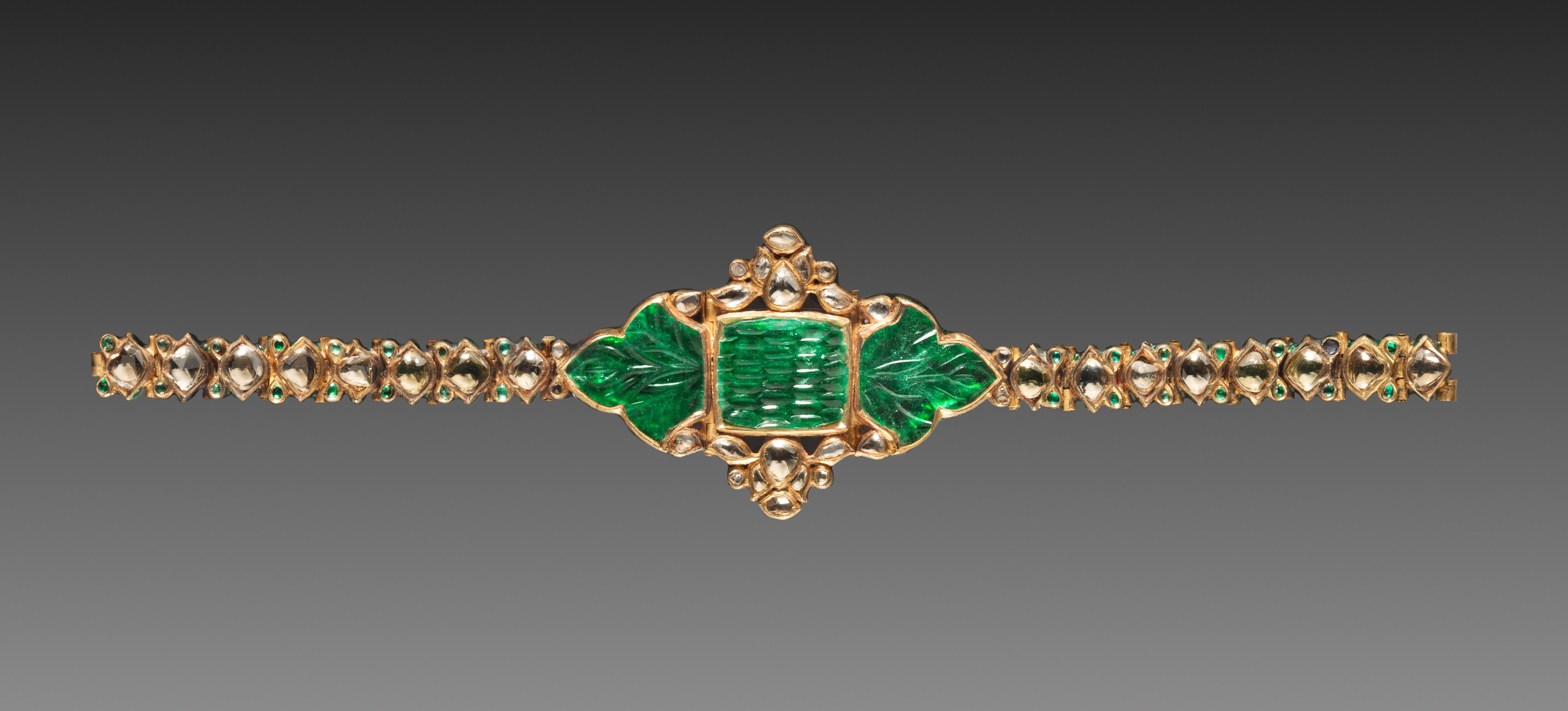 Mughal gold bracelet with inset emeralds, diamonds, and enamel, c. 1700-1800.jpg