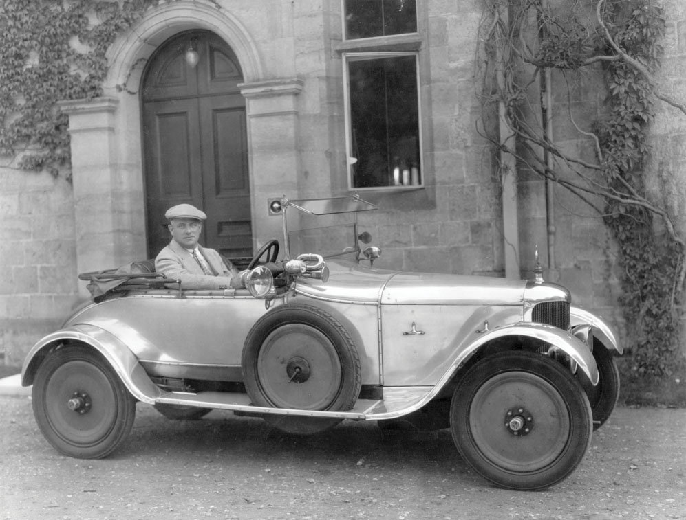 English comic novelist P. G. Wodehouse (1881 - 1975) at the wheel of an AC Royal Roadster outside Hunstanton Hall, the Norfolk home of his friend Charles Le Strange, 1928.jpg