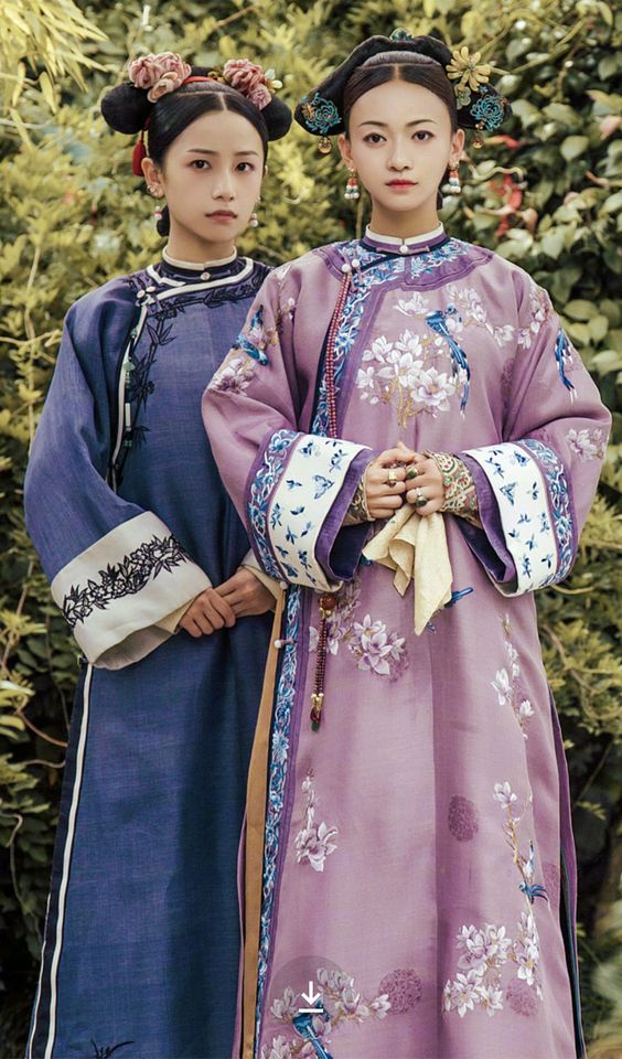 Chinese women wearing Qipao (traditional Chinese outfit).jpg
