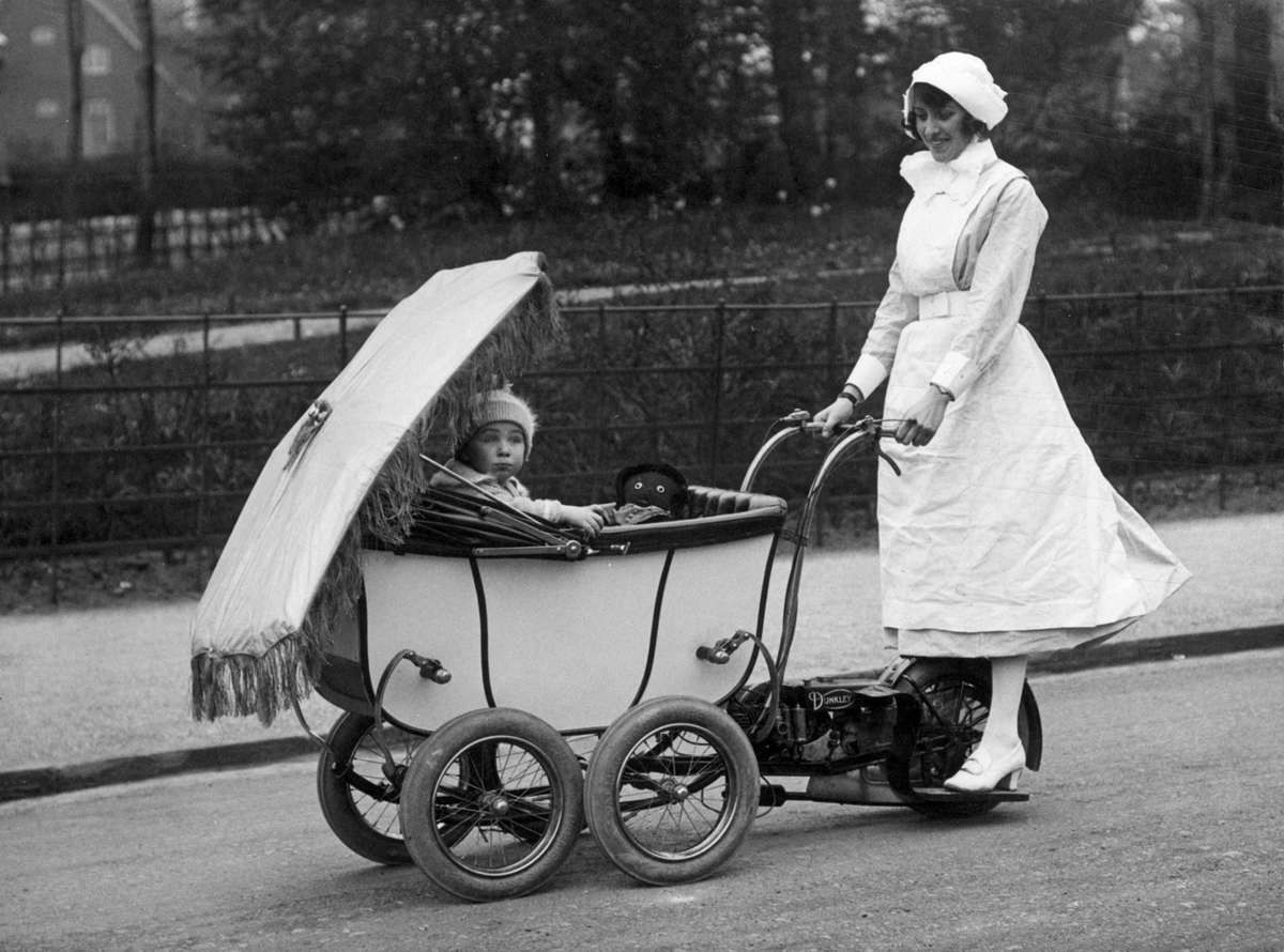 An English Nanny, driving a motorized pram in 1922.jpg