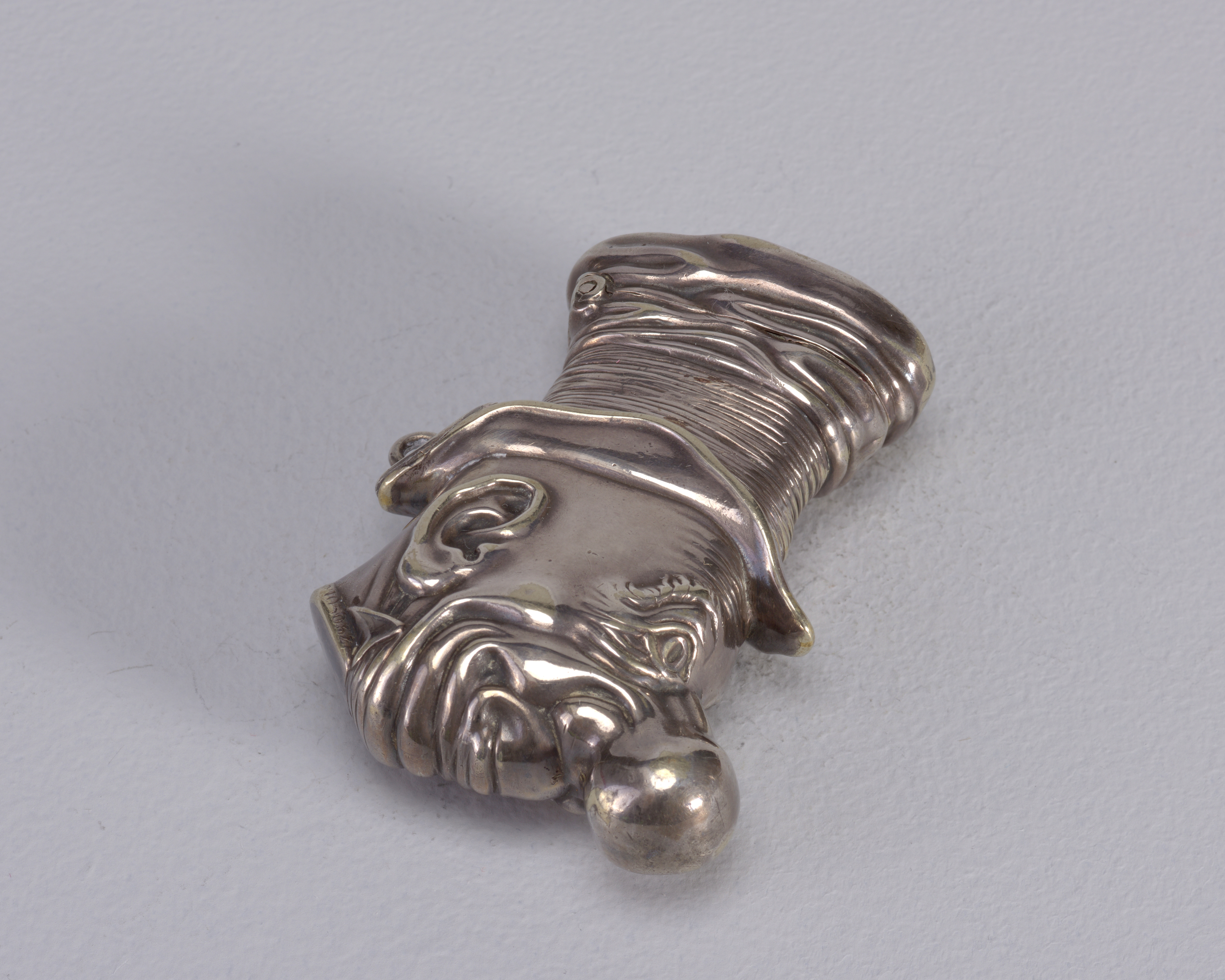 Plated brass matchsafe in the shape of the head of early comic strip character Ally Sloper, British, c. 1888.jpg