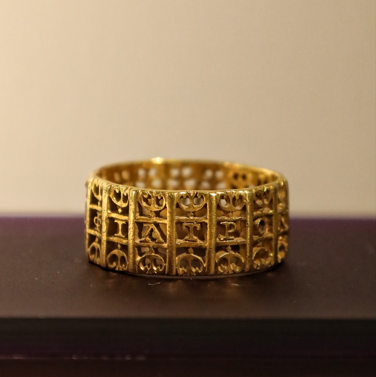 A Roman gold ring with an openwork Greek inscription ('The Love Token Of Polemius'), ca. 2nd c., Corbridge Roman Museum, Hadrian's Wall, Northumberlandm England.jpg