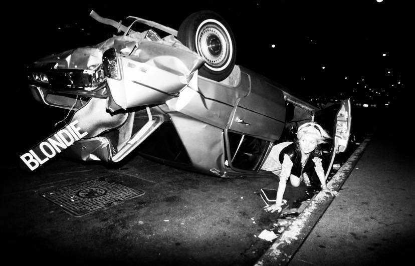 Debbie Harry of Blondie crawling out of a wrecked car in September 1976.jpg