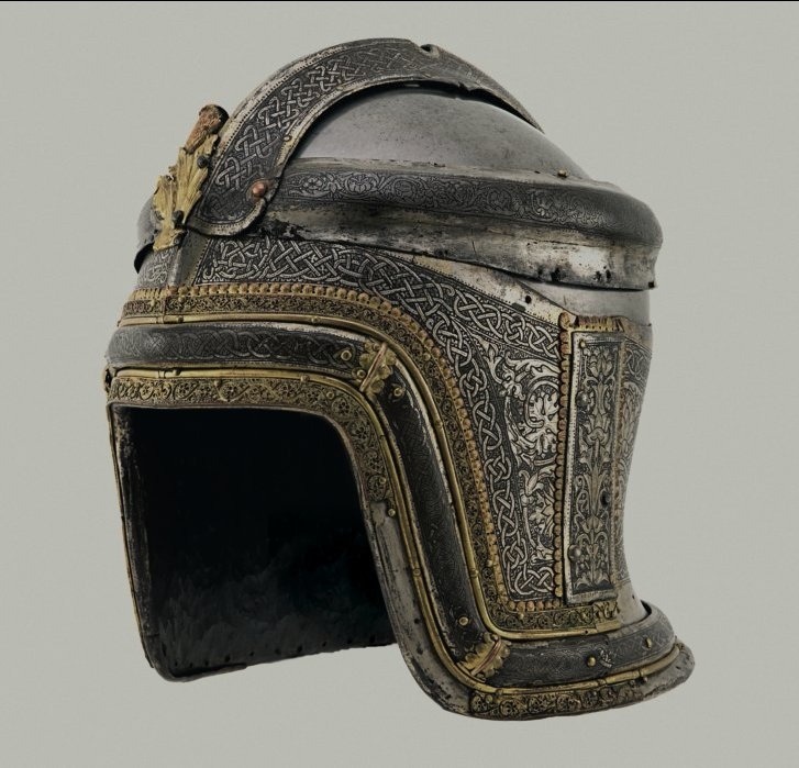 Helmet of Philip the Handsome, Duke of Burgundy from 1482 to 1506. Etched, gilt, and silvered steel, gold filigree by Negroli of Milan. Royal Armory, Madrid.jpg