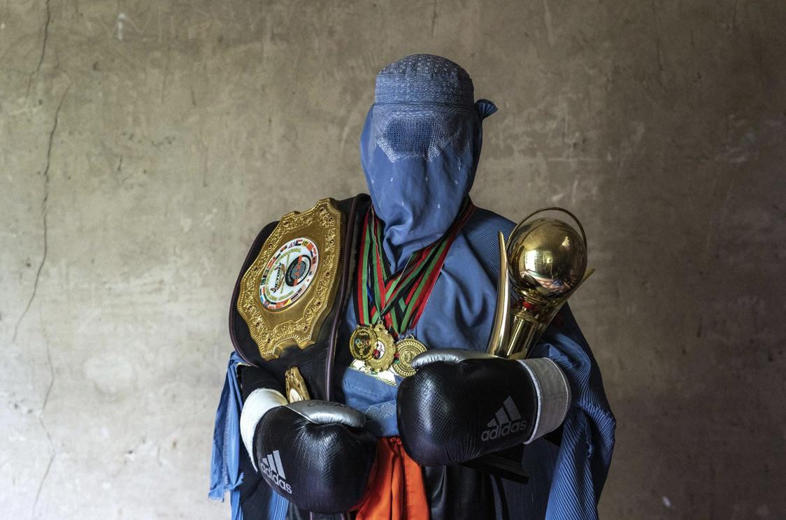 Afghan Mixed Martial Arts Fighter Poses with her Trophies in Kabul Afghanistan.jpg