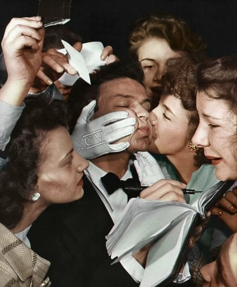 Ol' blue eyes, getting mobbed by autograph hunters in the 1940s.png