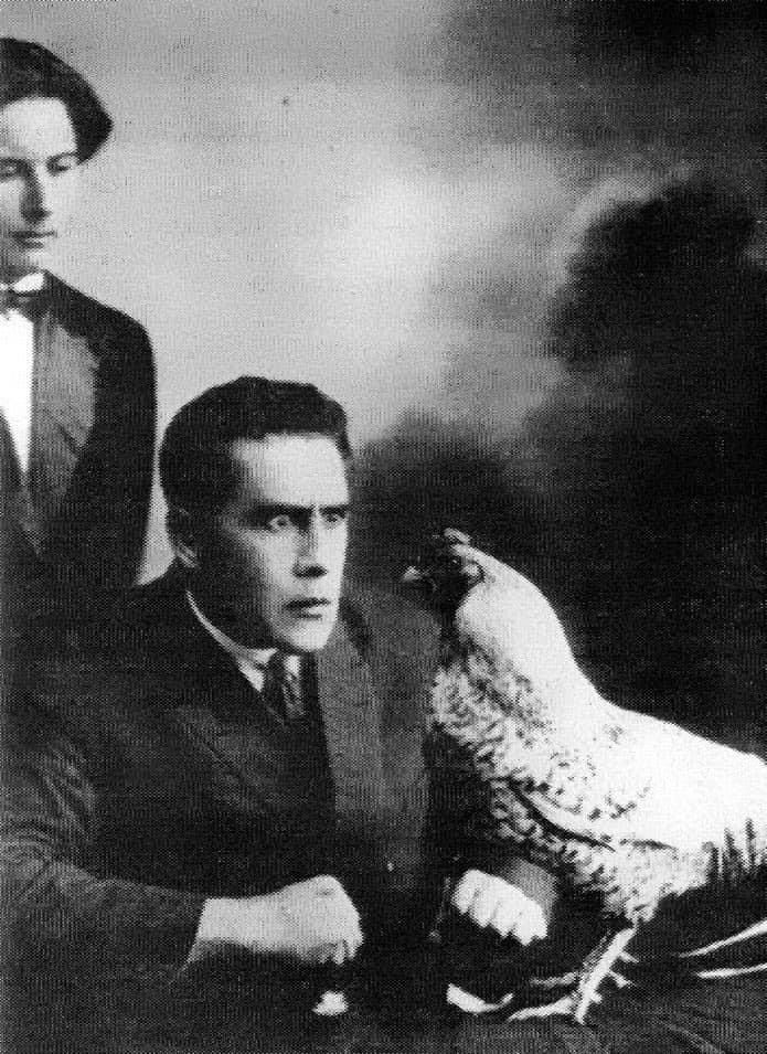 Soviet poet, body-builder & futurist Vladimir Goldschmidt hypnotizing a chicken, 1923.jpg