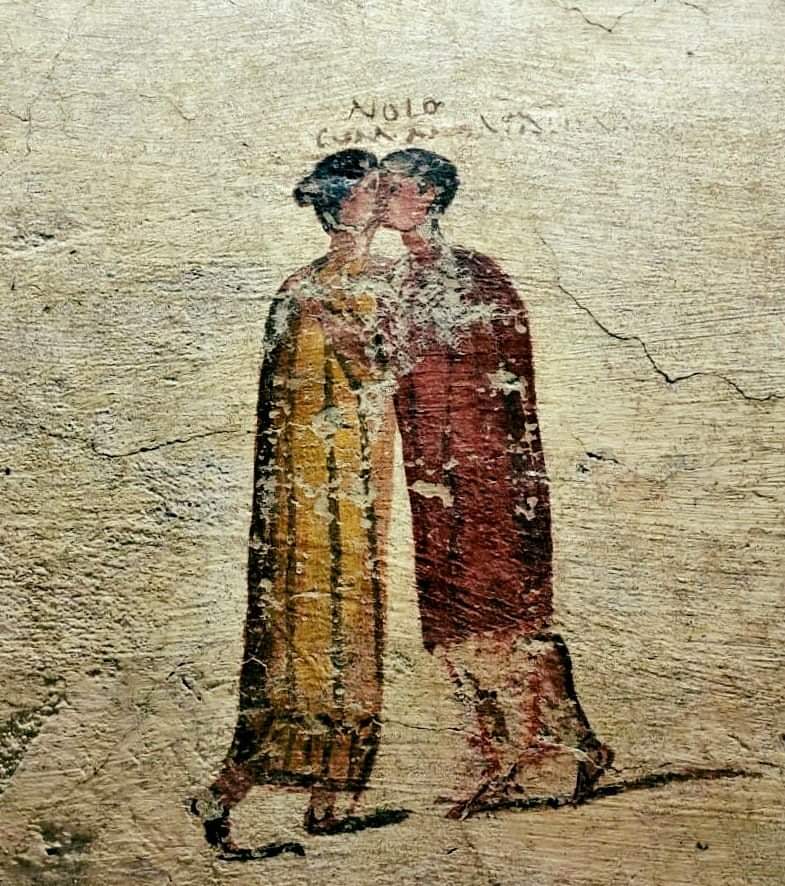 A fresco from Pompeii showing the kiss of a Roman couple. Above is the inscription - NOLO CUM MYRTALE, which can be translated as - 'I don’t want to (do this) with Myrtale'.jpg