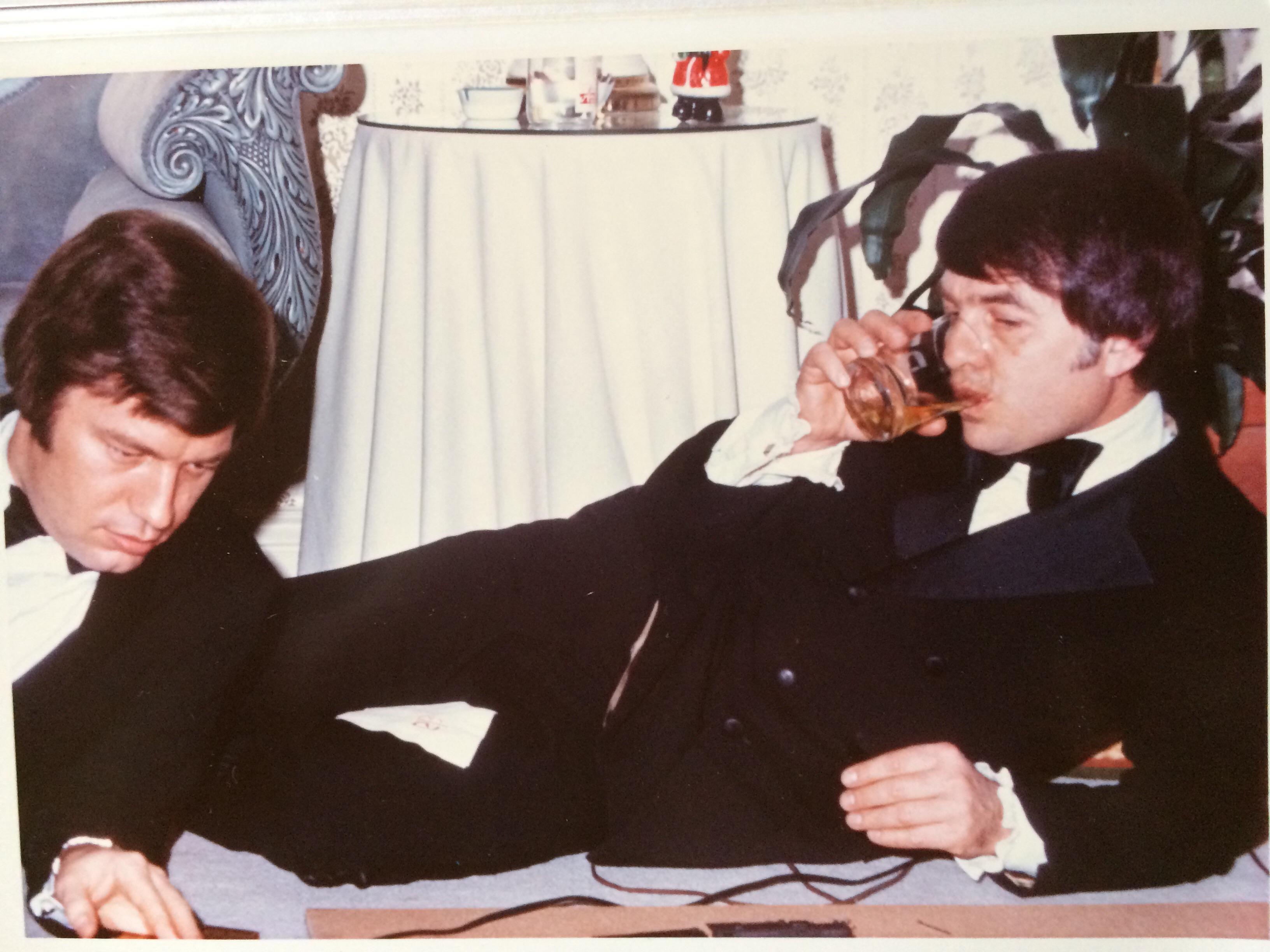 my grandpa and his friend playing with a toy train at a wedding party, 60s.jpg