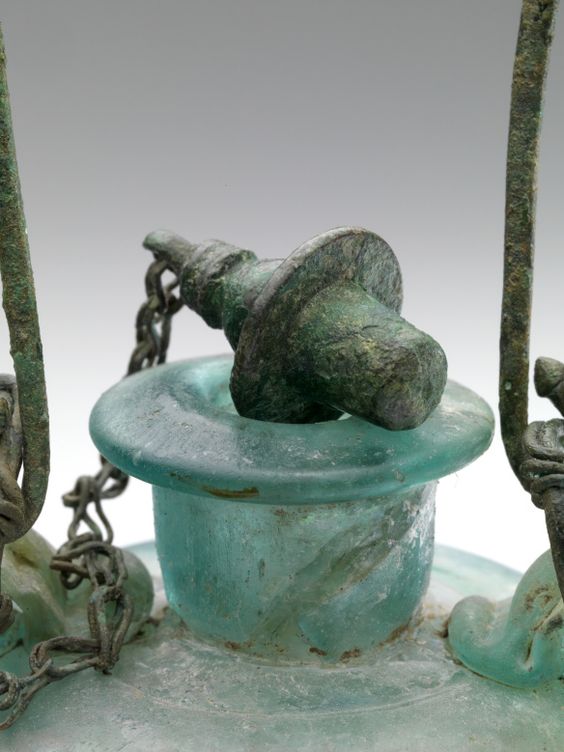 Roman glass vessel – aryballos – with chain and stopper. Dated to the second half of the 1st century CE. The facility was used to store oils and perfumes.jpg