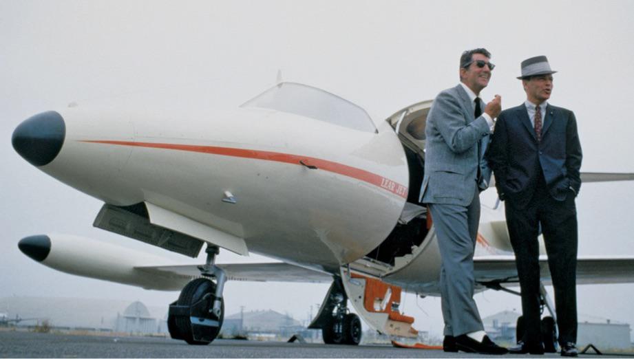Dean Martin and Frank Sinatra outside of Sinatra's Learjet in the mid-60s.jpg