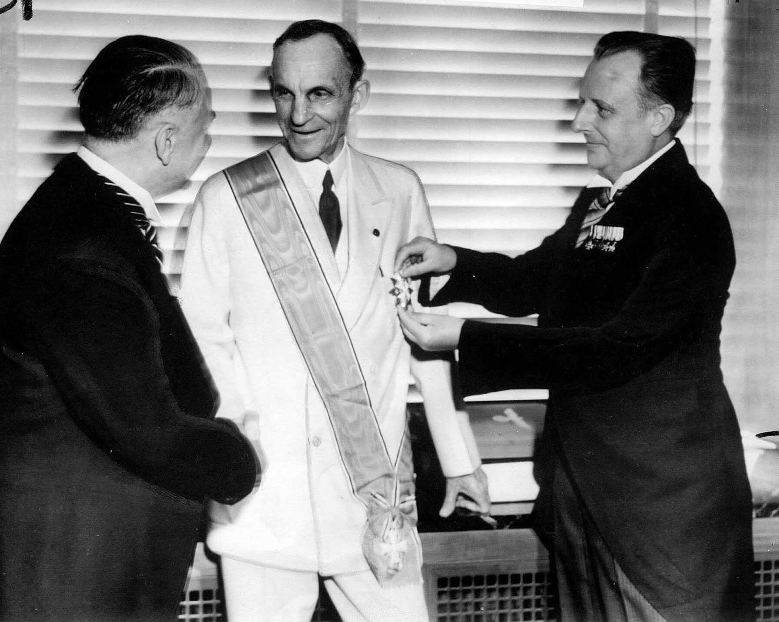 Henry Ford receiving the Grand Cross of the German Eagle from Nazi officials, 30 July 1938, on his 75th birthday.jpg
