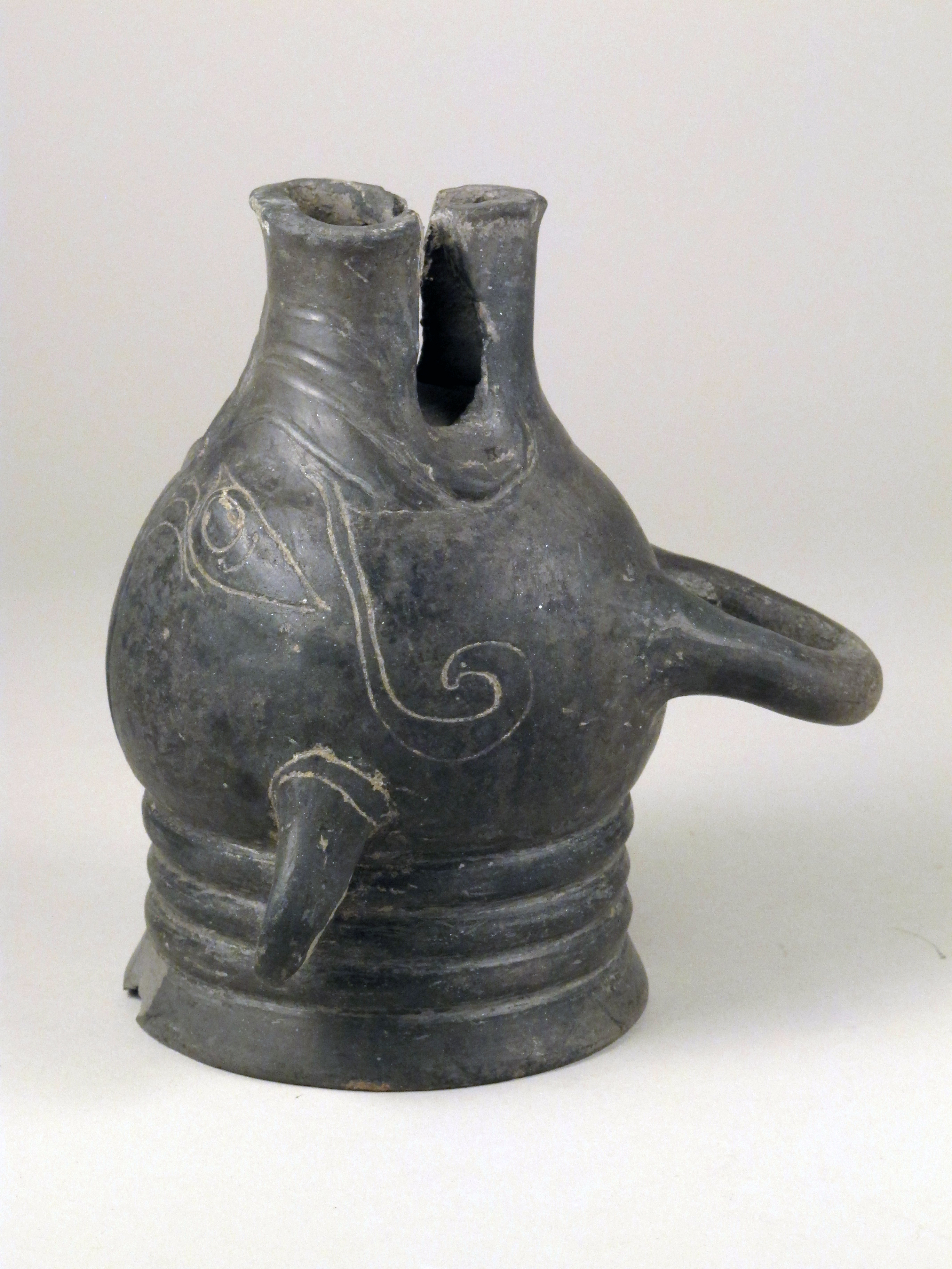 Ancient Etruscan terracotta cup in the shape of a pig's head, c. 6th century BCE.jpg