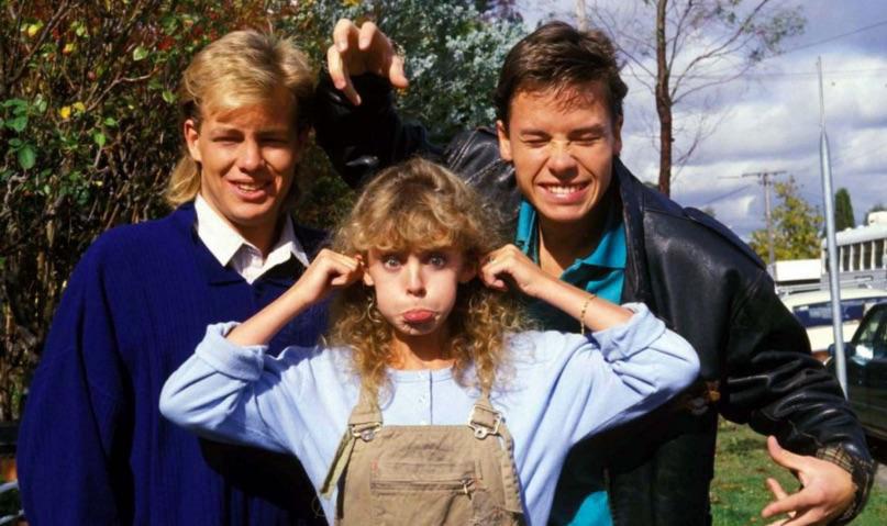 Jason Donovan, Kylie Minogue and Guy Pearce, 1980s.jpg