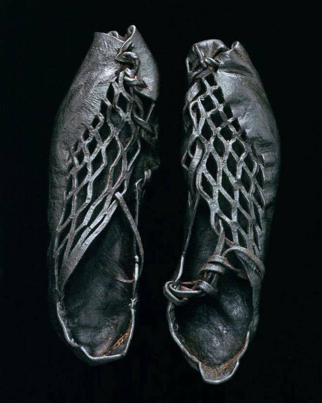 A pair of intricately cut shoes that were found on a bog-body from over 2,300 years ago. They belonged to a German man from Damendorf, Schleswig-Holstein, who died back in 300 BC.jpg