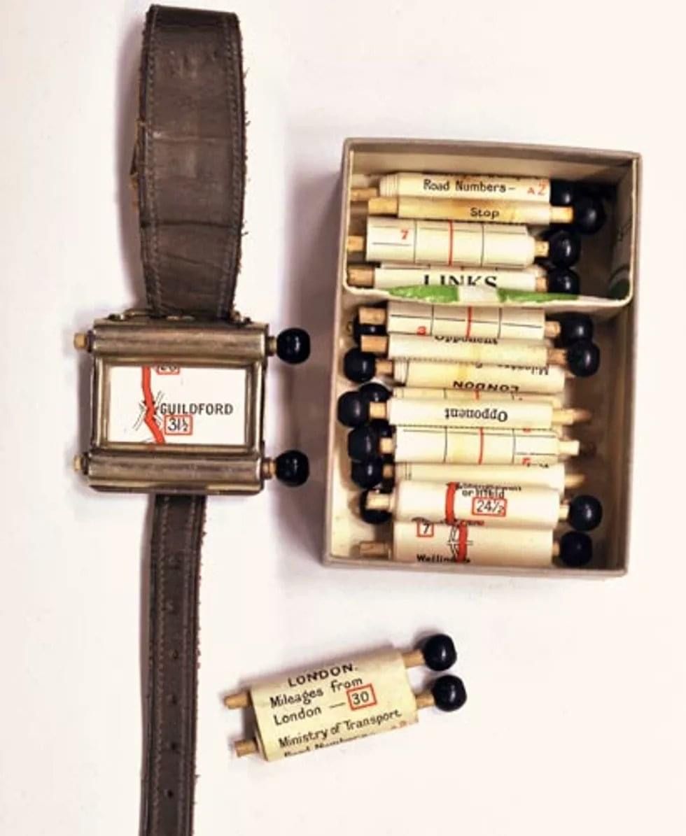 The Plus Four Wristlet Route Indicator, a British product from the 1920s, is a scroll-map navigator in the shape of a watch.jpg
