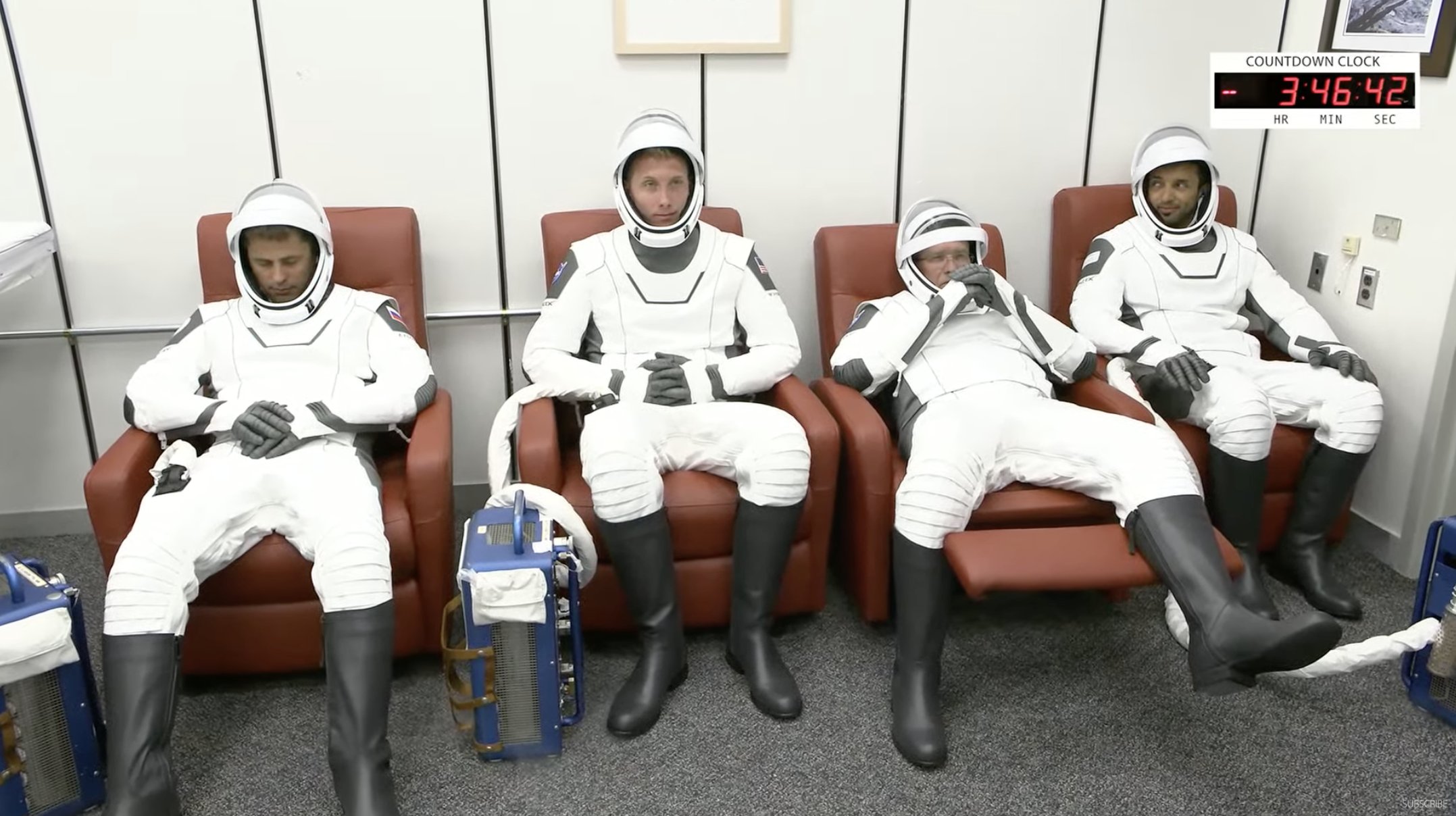 The four crew members of NASA Crew-6 rest after putting on their suit.jpg