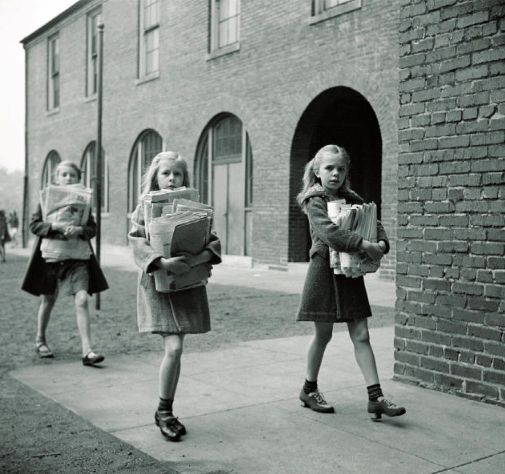 Children carry their weekly contribution of scrap paper to school in Washington, D.C., as part of the 'Salvage for Victory' program. August 1942.jpg