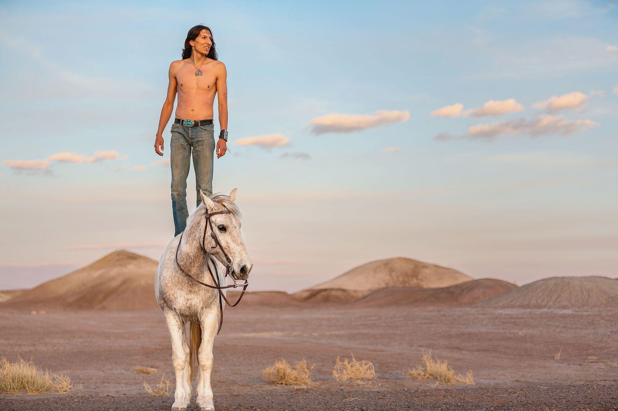 Clayson Benally, a member of the Navajo Nation, photographed with his horse.jpg