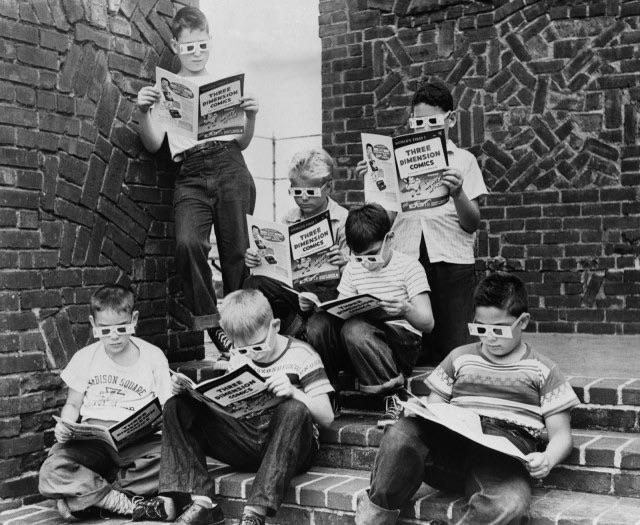 A group of boys read 3-D comic books at the Madison Square Boys Club, 1953.jpg