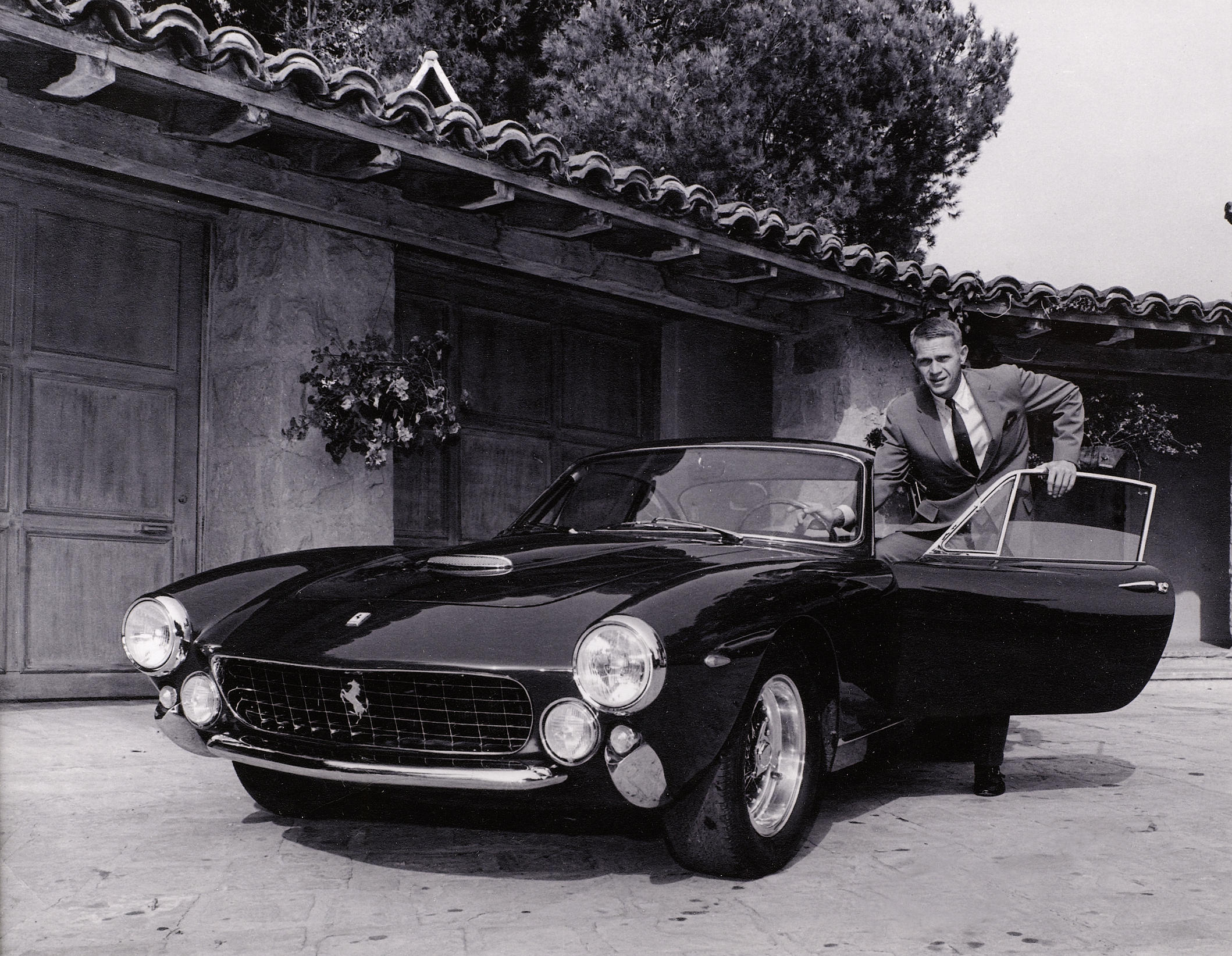Steve McQueen with his 34th birthday present from his wife Neile Adams, 1964.jpg