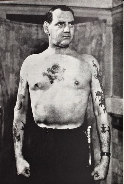 King Frederick IX of Denmark showing off his tattoos. 1951.jpg