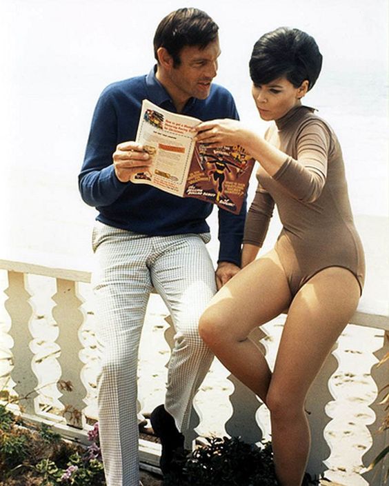 Adam West and Yvonne Craig reading comic book, off duty 1968.jpg