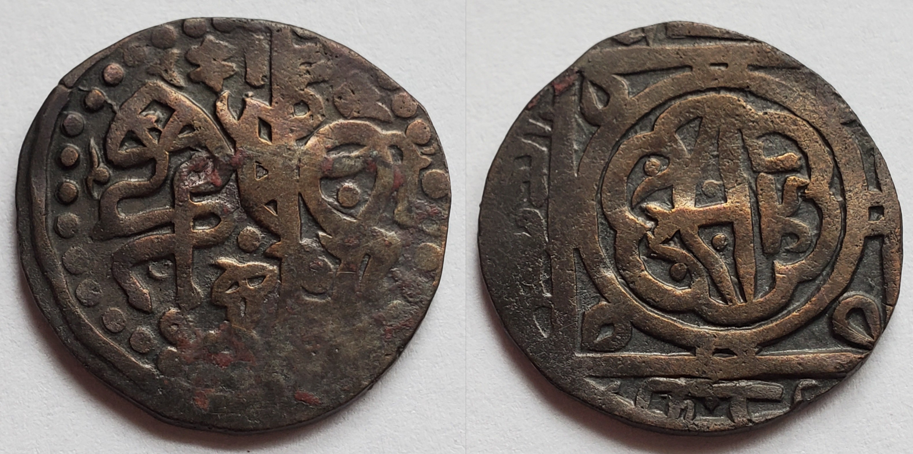 Billon jital of Genghis Khan, minted at Qunduz, Afghanistan, after 1221. Stylized horseman left, bow within ornate pattern.jpg