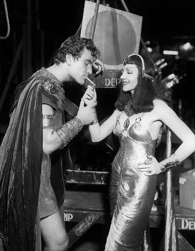 Henry Wilcoxon and Claudette Colbert on the set of Cleopatra, 1934.jpg