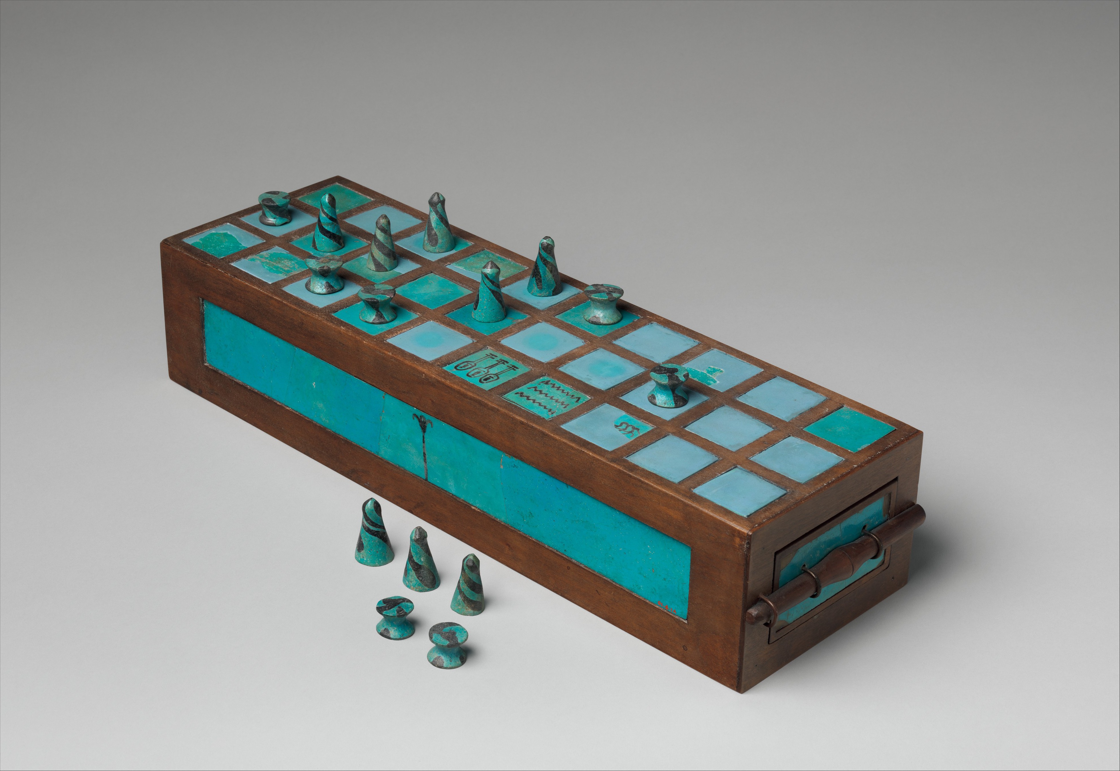 Restored ancient Egyptian wooden-faience senet game board with pieces made of faience, c. 1550-1295 BCE.jpg