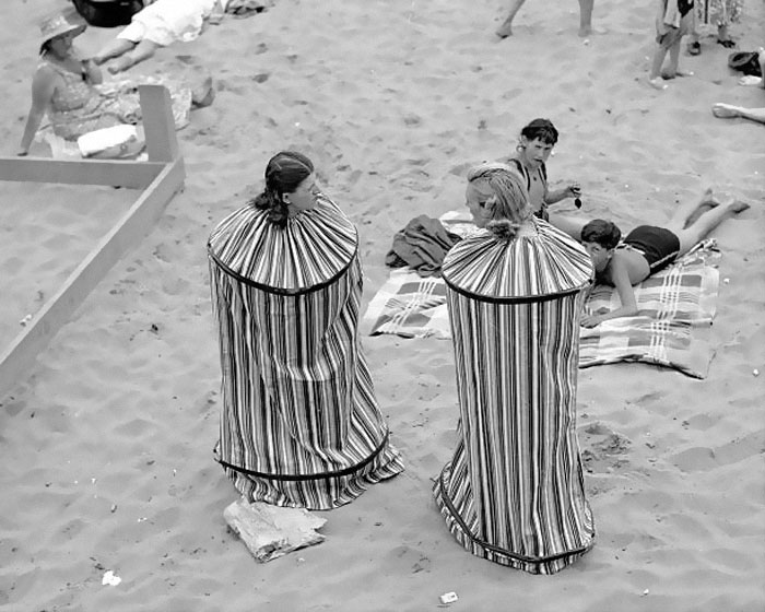 Rita Perchetti And Gloria Rossi Try Out Their New Portable Bathhouse So They Can Change Their Clothes After Sunbathing On Coney Island Beach, 1938.jpg