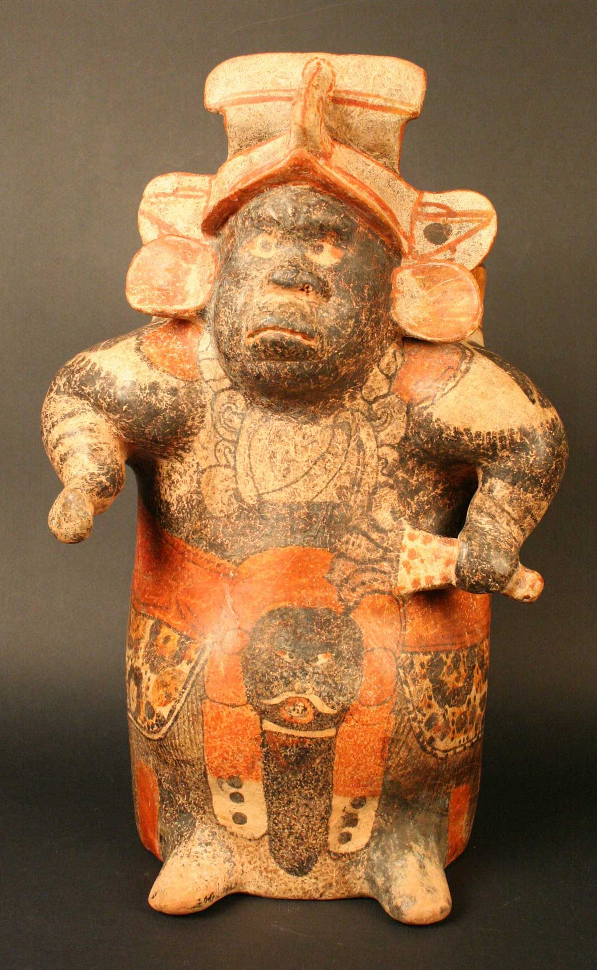 A Maya ceramic vase in the form of a hunchbacked dwarf. 600-900 CE, now housed at the Chilean Museum of Pre-Columbian Art.jpg