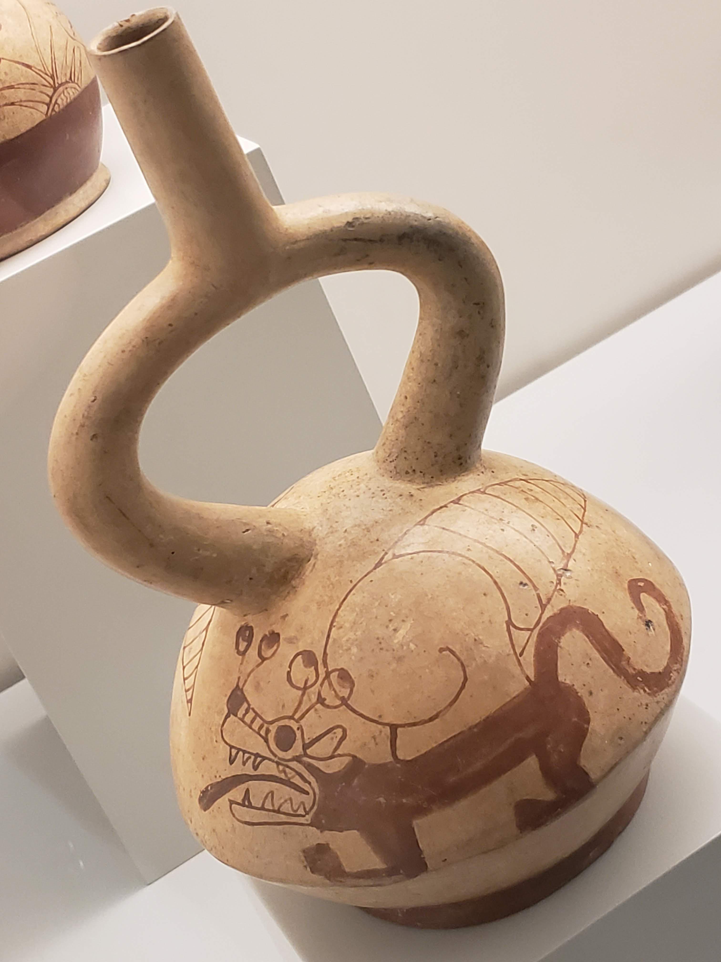 Painted ceramic vessel depicting a creature with feline features and a snail-like shell, possibly related to an origin myth. Moche culture, Peru, ca. 100 BC - 700 AD. Museo de América, Madrid.jpg