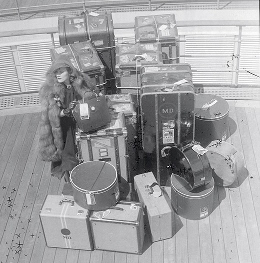 Marlene Dietrich with her luggage aboard the SS Normandie in 1936. Photo by Martin Munkasci.jpg