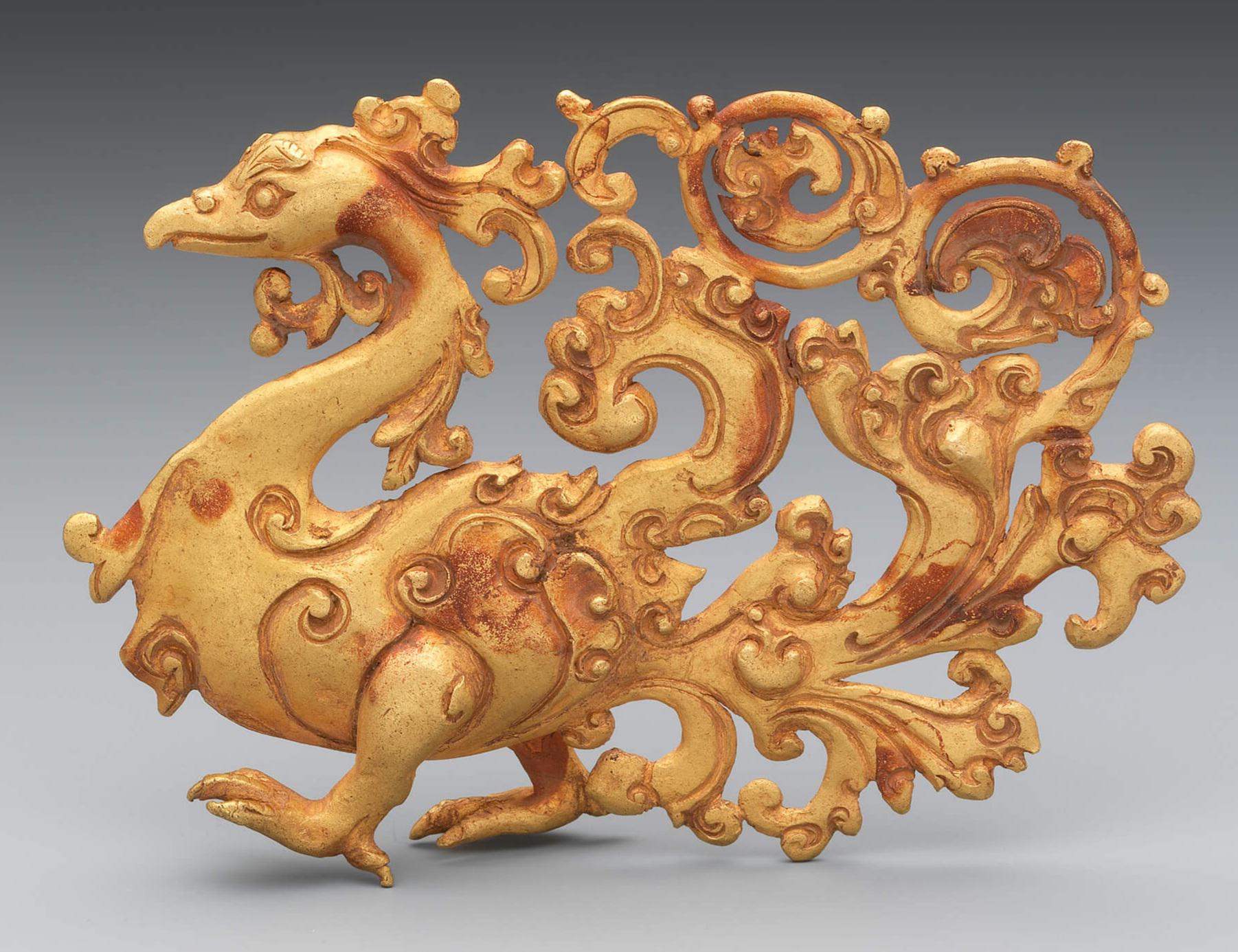 A golden sculpture of a strutting bird. From Java in Indonesia, 7th-15th century CE.jpg