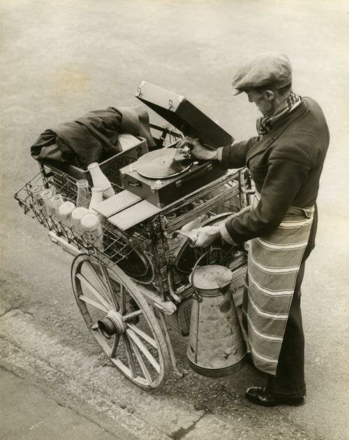 Musical milk on a street, England, 1930.jpg
