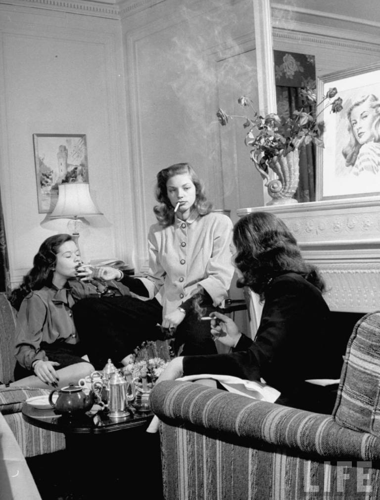 Lauren Bacall & Friends 1945 - Lighting the lady's cigarette without looking... Cool factor.jpg