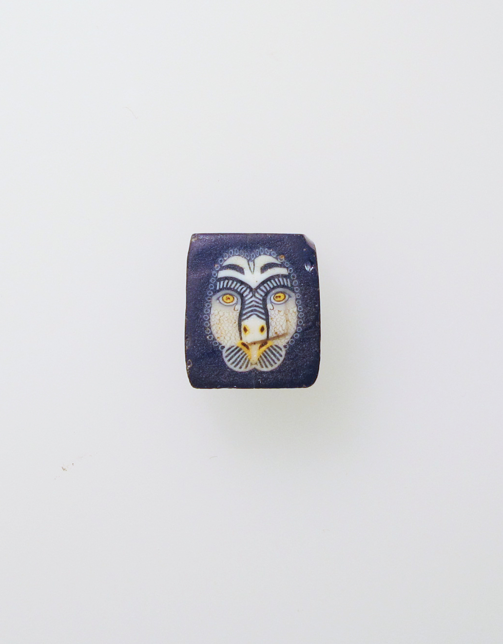 Ancient Roman-era Egyptian mosaic glass inlay featuring an image of the head of an owl, c. 1st century BCE–1st century CE.jpg