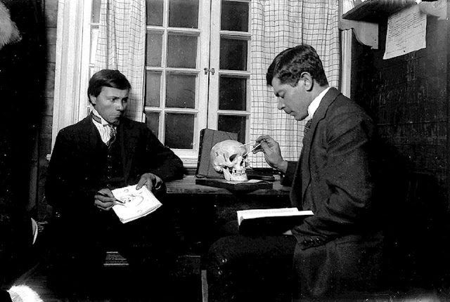 A craniologist demonstrates how to measure a human skull. Sweden, 1915.jpg